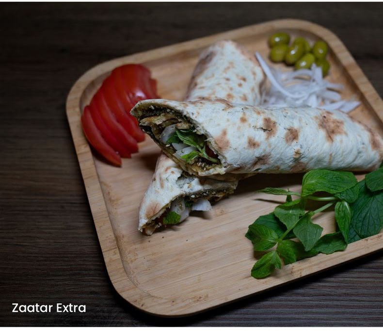 Zaatar manakish rolled with vegetables and fresh mint